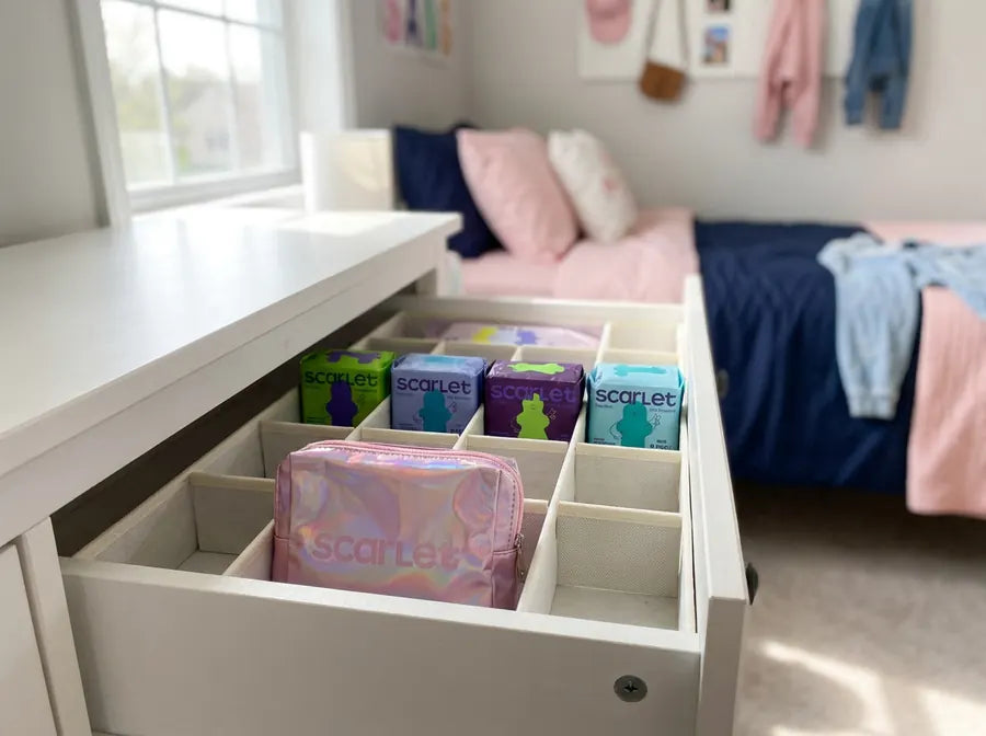 A dresser drawer with Scarlet pad packs sorted by size