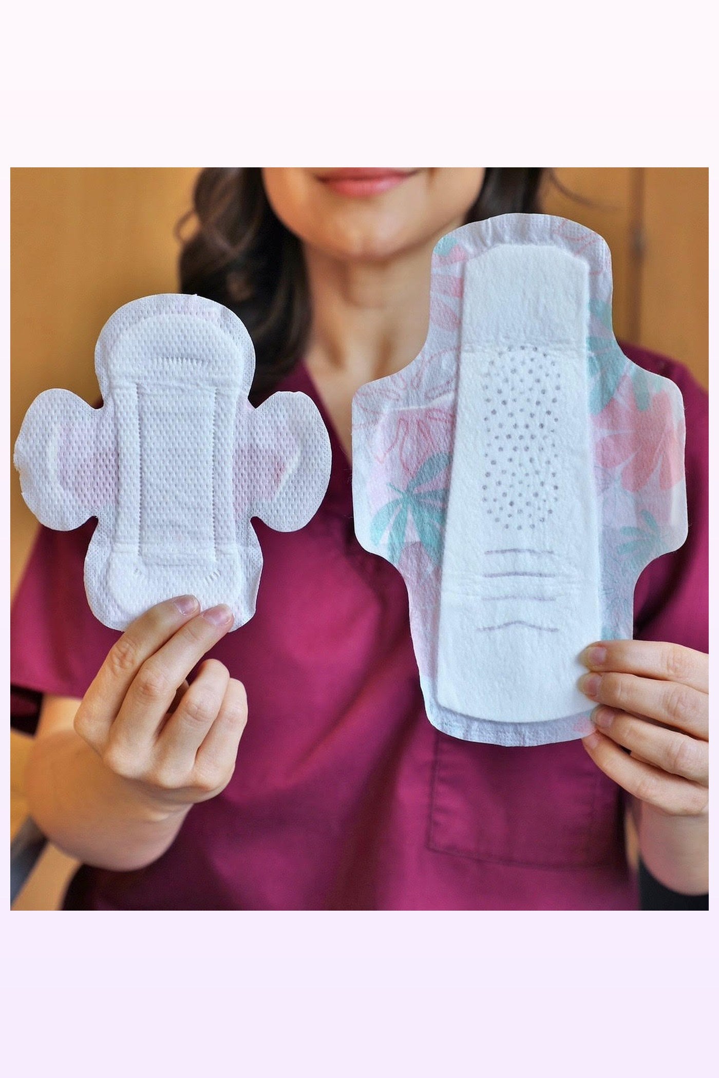 Nurse holding a Scarlet size pad beside an adult size pad