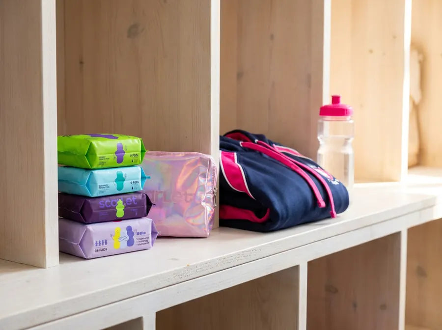 Scarlet pad packs and pouch in a locker room cubby
